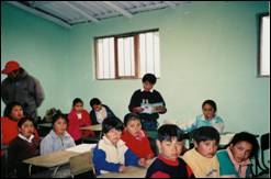 Children attending class at their new school in a village in Ecuador<br>Photo from www.freethechildren.org