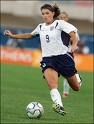 Mia Hamm dribbles the soccer ball. (www.images.google.com)