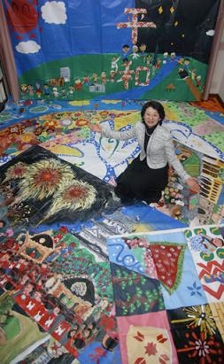 Atsuko surrounded by Art Miles Murals (JAM)