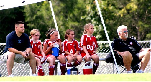 Jack Hitchens watches his U12 girls team play. (Hannah Leake)