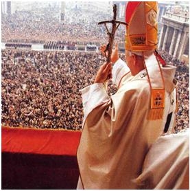 The Pope stands before thousands of people. (http://www.jesuschristsavior.net/JohnPaul.jpeg )