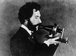 Bell speaking into his telephone (www.lazacode.com)