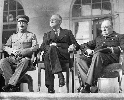 Roosevelt sitting with Churchill and Stalin