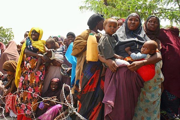 Somalis await aid at a camp in the Howlwadag district of Mogadishu on Aug. 25, 2011. Drought in the 
