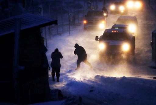 Cars line up at an exit ramp covered in snow at the Oceti Sakowin camp where people have gathered to protest the Dakota Access oil pipeline in Cannon Ball, N.D., Tuesday, Dec. 6, 2016. Many Dakota Access oil pipeline opponents who've gathered for months in the camp are committed to staying despite wintry weather and demands that they leave. An overnight storm brought several inches of snow, winds gusting to 50 mph and temperatures that felt as cold as 10 degrees below zero. (AP Photo/David Goldman)