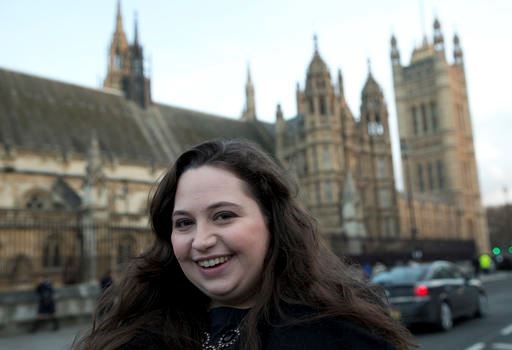 In this Tuesday, Feb. 3, 2015 file photo, Rachel Kean activist and campaigner poses for the Associated Press outside the Palace of Westminster, after she witnessed the vote on 3 parent babies in the House of Commons, in London. Britain's fertility regulator has approved controversial techniques allowing doctors to create babies using the DNA from three people — what it called a 