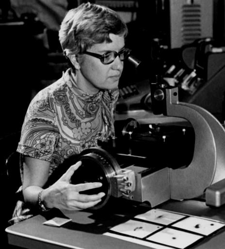 In this image taken in the 1970s and provided by the Carnegie Institution of Washington, Vera Rubin uses a measuring engine. Rubin, a pioneering astronomer who helped find powerful evidence of dark matter died Sunday, Dec. 25, 2016. She was 88. (Carnegie Institution of Washington via AP)