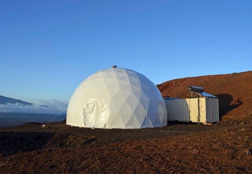 This April 25, 2013 photo provided by the University of Hawaii shows the domed structure that will house six researchers for eight months in an environment meant to simulate an expedition to Mars, on Mauna Loa on the Big Island of Hawaii. The group will enter the geodesic dome Thursday, Jan. 19, 2017, and spend eight months together in the 1,200 square foot research facility in a study called Hawaii Space Exploration Analog and Simulation (HI-SEAS). They will have no physical contact with any humans outside their group, experience a 20-minute delay in communications and are required to wear space suits whenever they leave the compound. (Sian Proctor/University of Hawaii via AP)