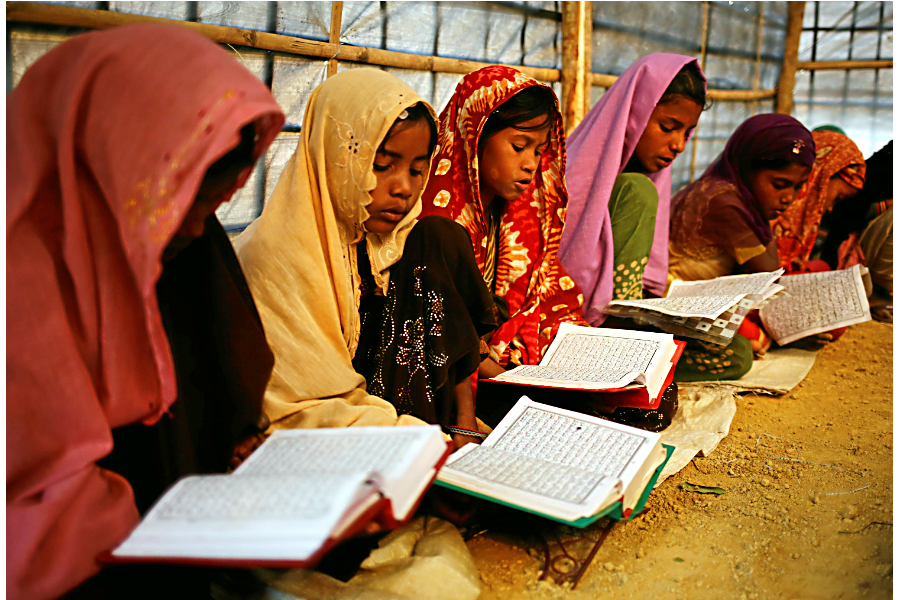 Rohingya refugee children attend an Arabic school to learn to recite the Quran at Kutupalang Makeshift Refugee Camp in Cox’s Bazar, Bangladesh, Feb. 12.  (Mohammad Ponir Hossain/Reuters)