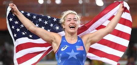 Helen celebrates her win by raising the flag  (Sports illustrated  ())