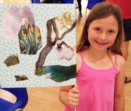 A young artist shows off her creation at the 2017 Imagination Celebration