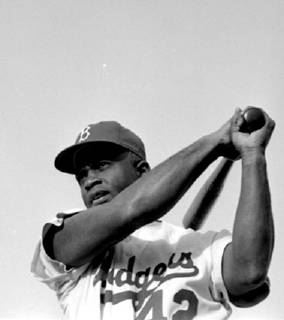 Jackie Robinson hiting a ball (http://www.home-team-sports.com/image_manager/Jackie_Robinson.jpg)