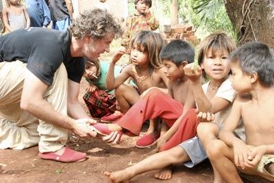 Blake giving new shoes to children in need 