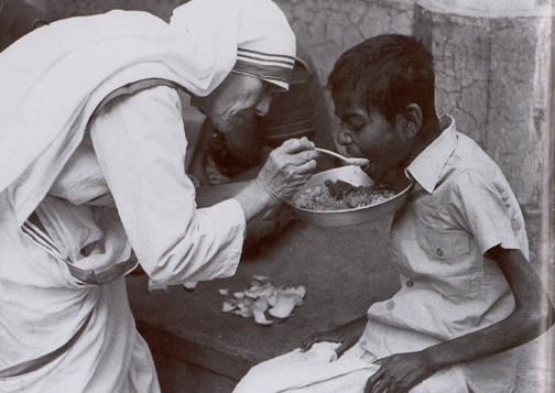 Mother Teresa gently feeding a child (http://www.helpinghands.lk/blog/mother-teresa/ (Helping Hands))