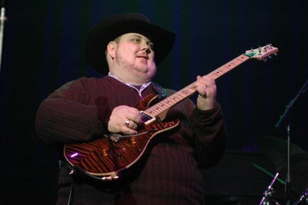 <a href=http://www.johnnyhiland.com/images/2_06/05.jpg>Johnny Hiland playing at the Winter NAMM festival </a>