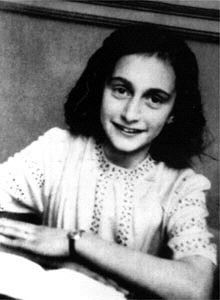 Anne Frank at her desk.
