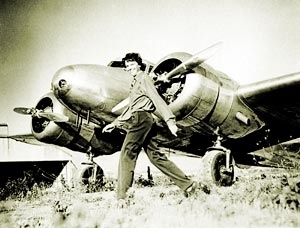 She is walking by her plane (http://www.ameliaearhart.com/about/historicalphotos.html)