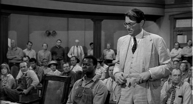Atticus in Court in the movie, To Kill a Mockingbird (http://www.math.ucsd.edu/~dwildstr/reviews/movies/images/to-kill-a-mockingbird-full.jpg)