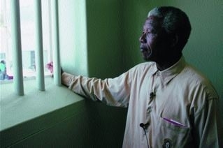 Nelson Mandela in his jail cell. (http://stevecotler.com/)