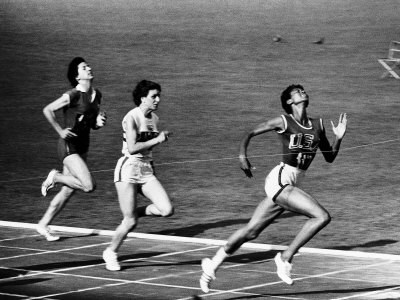 Rudolph crossing the finish line. (http://www.art.com/products/p14005687-sa-i2829868/mark-kauffman-us-runner-wilma-rudolph-winning-womens-100-meter-race-at-olympics.htm ())