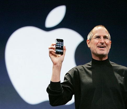 Steve Jobs holding a iPhone (Crushable.com (Natalie Zutter))