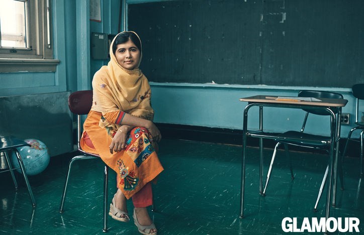 Malala sitting at a Pakistani school desk (http://www.glamour.com/inspired/women-of-the-year/ (Cindi Leive))