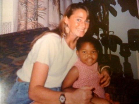 Amy Biehl with an African child. (Moments in U.S. Diplomatic History)