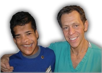 Yordano, an 11-year-old boy from rural Panama born with a cranial deformity, and <a href=http://www.mmissions.org/top/first_child.html>MMC's first patient</a>, along with his doctor.