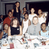 Holdsclaw poses with junior WNBA members at the Women's Research and Education Institute awards gala.