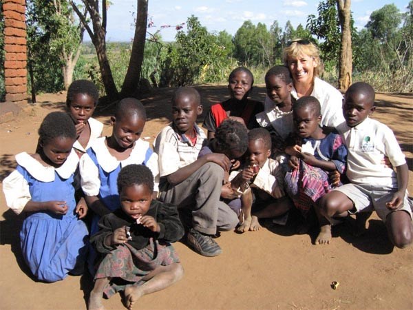 Wendy Milette with children in Manola Village, Malawi Africa 2006