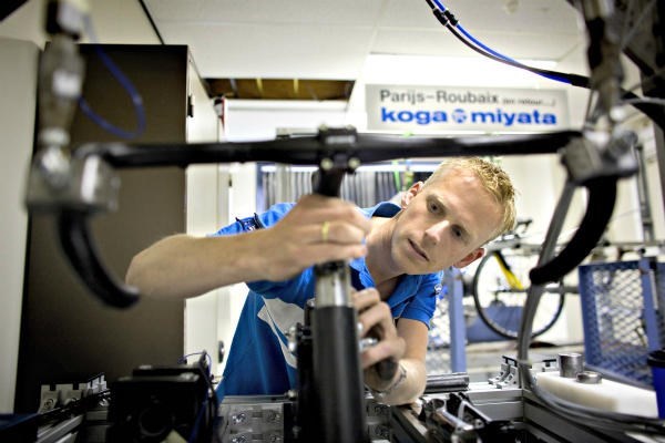 A technician examines a broken Koga Miyata bicycle in the Dutch town of Heerenveen. A 'repair cafe' movement, in which people gather together to fix (and learn how to fix) everyday items from bicycles to lamps, is spreading from The Netherlands to the US and elsewhere. <P> Jerry Lampen/Reuters/File