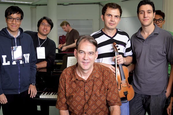 John Ferguson (c.) poses with a class at the YES Academy in Bangkok, Thailand, during a week-long workshop in American musical genres.  <P>Tibor Krausz