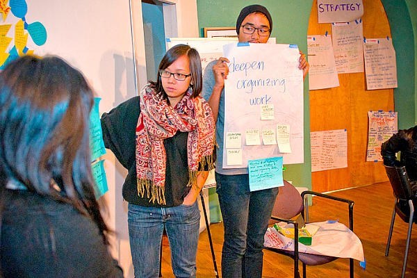 Members of VietUnity in Oakland, Calif., hold a planning session. The group brings Vietnamese-identified people together to work on issues that members have identified as most important to their daily lives, including affordable housing, education, employment, and gang and domestic violence.  <P>Courtesty of VietUnity