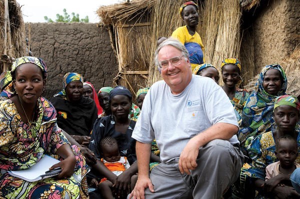 Farmer and philanthropist Howard Buffett meets with women in Cameroon who are part of a World Food Program farming cooperative.  <P>Laura Melo/The Howard G. Buffett Foundation