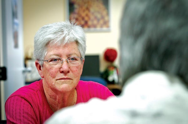 Sister Mary Sean Hodges talks with a former inmate that volunteers at the Office of Restorative Justice for the Archdiocese of Los Angeles.  <P>Tony Avelar/The Christian Science Monitor