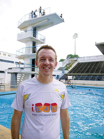 David Hunt at the pool in Phnom Penh, where he coaches a Cambodian children’s swim team. <P> Julie Masis
