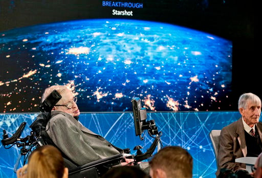 Cosmologist Stephen Hawking, left, joined by a group of of scientist including Princeton physicist Freeman Dyson, right, announce the new Breakthrough Initiative focusing on space exploration and the search for life in the universe, during a press conference, Tuesday, April 12, 2016, at One World Observatory in New York. The $100 million project is aimed at establishing the feasibility of sending a swarm of tiny spacecraft, each weighing far less than an ounce, to the Alpha Centauri star system. (AP Photo/Bebeto Matthews)