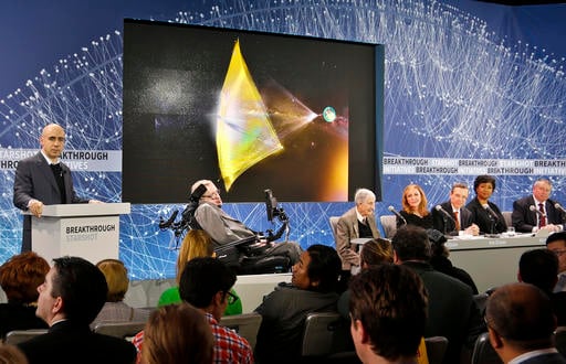 Internet investor and science philanthropist Yuri Milner, and a panel of scientists including renowned cosmologist Stephen Hawking, second from left, Princeton physicist Freeman Dyson, science author Ann Druyan, center, Harvard physicist Avi Loeb, third from right, NASA astronaut Dr. Mae C. Jemison, second from right, and former NASA director Pete Worden, far right, announce the new Breakthrough Initiative focusing on space exploration and the search for life in the universe, during a press conference, Tuesday, April 12, 2016, at One World Observatory in New York. The $100 million project is aimed at establishing the feasibility of sending a swarm of tiny spacecraft, each weighing far less than an ounce, to the Alpha Centauri star system. (AP Photo/Bebeto Matthews)