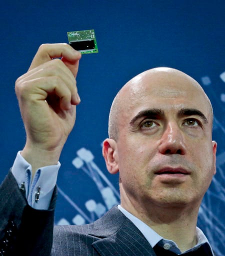 Internet investor and science philanthropist Yuri Milner shows the Starchip, a microelectronic component spacecraft , during a press conference announcing the new Breakthrough Initiative focusing on space exploration and the search for life in the universe, Tuesday, April 12, 2016, at One World Observatory in New York. The $100 million project is aimed at establishing the feasibility of sending a swarm of tiny spacecraft, each weighing far less than an ounce, to the Alpha Centauri star system. (AP Photo/Bebeto Matthews)