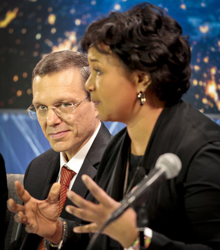 Harvard physicist Avi Loeb, left, listens as former NASA astronaut Dr. Mae C. Jemison, speaks during a press conference where scientists announced a new breakthrough initiative focusing on space exploration and the search for life in the universe, Tuesday April 12, 2016, at One World Observatory in New York. The $100 million project is aimed at establishing the feasibility of sending a swarm of tiny spacecraft, each weighing far less than an ounce, to the Alpha Centauri star system. (AP Photo/Bebeto Matthews)