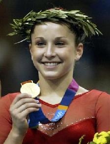 Carly Patterson shows crowd gold medal (www.carlypatterson)