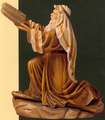 Moses holding up the Ten Commandments  (http://www.fraema.it/religiosa.asp)