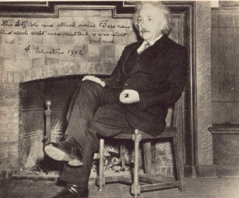 Albert Einstein sitting in a beautiful chair (Google )