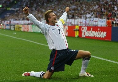 David Beckham celebrates after  he scored a goal (fifaworldcup.yahoo.com/.../ 2002/eng.html?i=7&d=1)