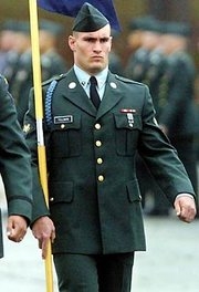 Pat carrying a flag while in the army.  (http://en.wikipedia.org/wiki/Pat_Tillman)