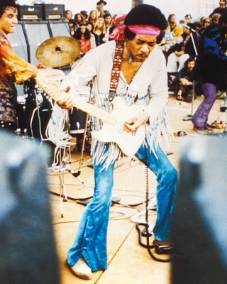 Jimi, playing at a concert. <br>(www.starpulse.com)