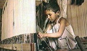 <a href=http://www.mythinglinks.org/ChildLabor~CarpetIndustry~nepalWeaving.jpg>A child weaving</a>