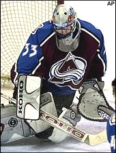 Patrick making a butterfly save. (http://nhl.speedera.net/photos/r/roy_down_tall.jpg)