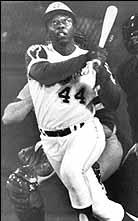 Hank Aaron hitting one of his many home runs. (http://www.baseball-almanac.com/players/p_aaroh4.shtml)