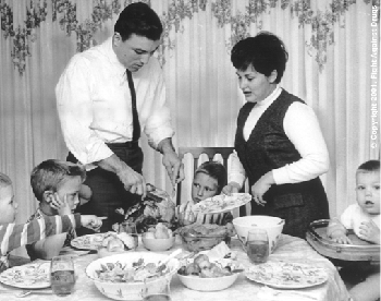 George and his wife Lynn serve Christmas dinner. (George Chuvalo, www.fightagainstdrugs.ca)